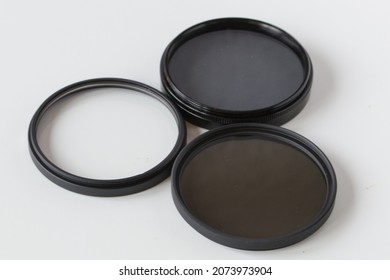 Set Of Screw-on Photographic Glass Filters For UV Protection, Polarizing Filter To Reduce Glare And Reflections And ND (neutral Density) Filter To Reduce Amount Of Light.