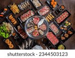 Set Shabu and Grill traditional japanese food
Raw Beef Sliced ​​and seafood for Japanese BBQ Yakiniku Cooking meat on the stove in a Japanese restaurant