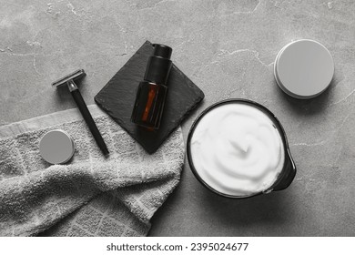 Set of shaving accessories on grunge grey background - Powered by Shutterstock