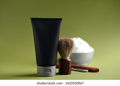 Set of shaving equipment and men's cosmetic products on color background