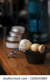 Set Of Shaving Equipment And Men's Cosmetic Products On Wooden Table, Barbershop. Shave Concept With A Straight Razor, Shaving Brush And Foam. Beard Care Products For Men On Background