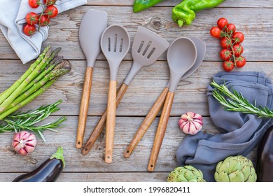 Set Of Silicone Kitchen Utensils On A Wooden Table