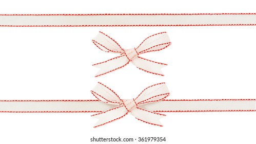 Set of silk red and white ribbon and bow isolated on white