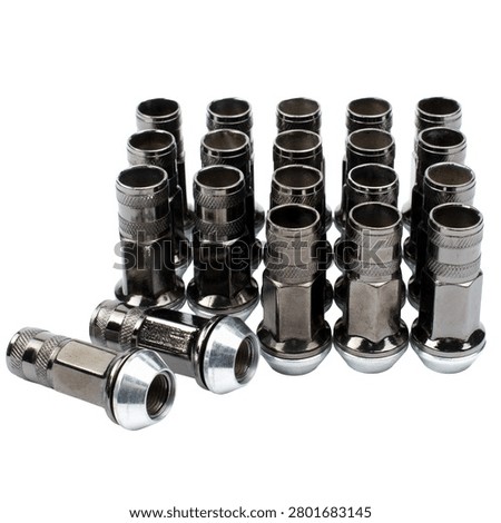 Set of silver chrome open-end wheel lug nuts isolated on white background