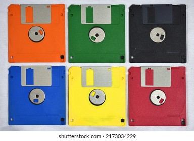 Set of six floppy disks of various colors forming a rectangle