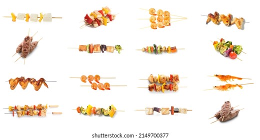 Set of skewers with meat, vegetables and shrimps isolated on white