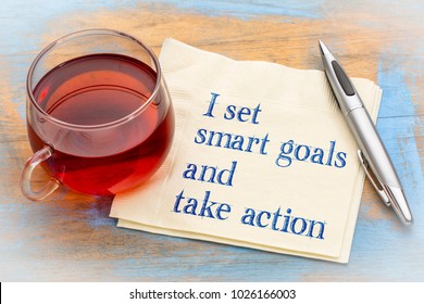 I set smart goals and take action - positive handwriting on a anapkin with a cup of tea - Shutterstock ID 1026166003