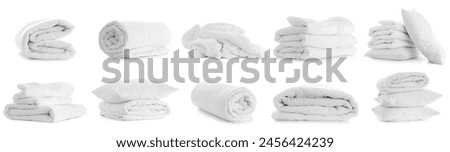 Set of soft blankets and pillows on white background