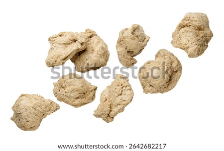 Set of soya chunks flying close-up on a white background. Isolated