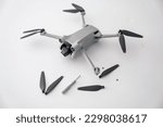 Set of spare propeller blades for drone or quadcopter. Damaged plastic drone rotor propeller blade caused by flying into an object and crashing.