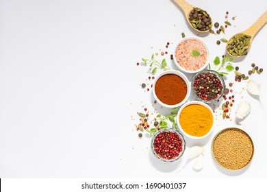 Set of spices and aromatic herbs on white background with copy space for your text. Aromatic spices for healthy lifestyle. Template culinary blog social media.
