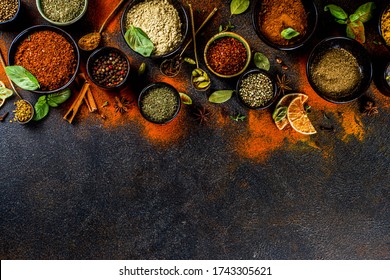 Set of Spices and herbs for cooking. Small bowls with colorful  seasonings and spices - basil, pepper, saffron, salt, paprika, turmeric. On black stone table top view copy space - Shutterstock ID 1743305621