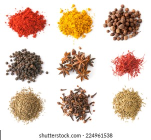 Set of spices (red and black pepper, allspice, saffron, curry, anise, cloves, cumin, coriander) isolated on white, top view - Shutterstock ID 224961538
