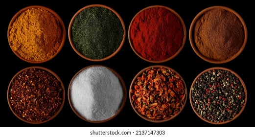 Set spices, turmeric powder, dry chopped dill, red paprika, cinnamon ground, spicy chili pepper flakes, sea ​​salt, dry chopped carrot pieces, colorful mixed pepper grains isolated on black  - Powered by Shutterstock