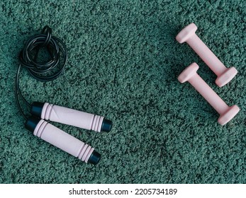 Set Of Sport Accessories On Green Background. Fitness Equipment. Sport Gear, Close Up