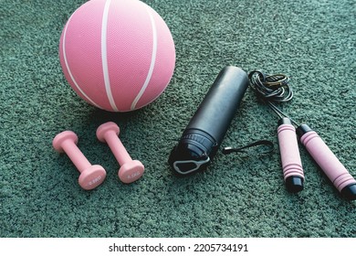 Set Of Sport Accessories On Green Background. Fitness Equipment. Sport Gear, Close Up