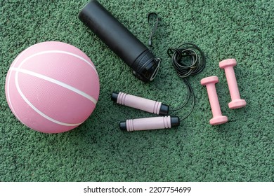 Set Of Sport Accessories On Green Background. Fitness Equipment. Sport Gear, Close Up	