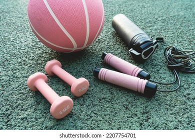 Set Of Sport Accessories On Green Background. Fitness Equipment. Sport Gear, Close Up	