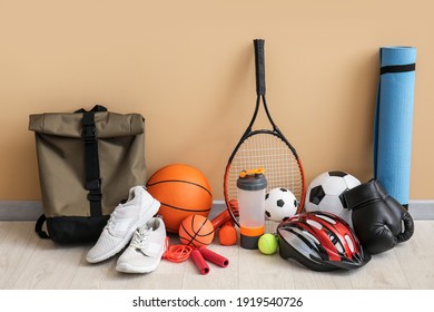 Set of sport equipment on floor near color wall - Shutterstock ID 1919540726