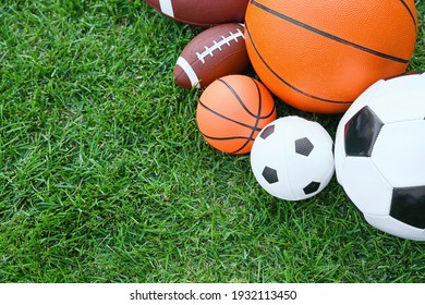 Set of sport equipment on green grass - Shutterstock ID 1932113450