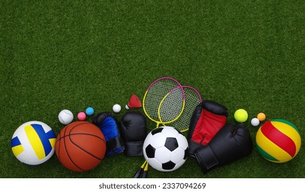 Set of sport equipment on green grass - Shutterstock ID 2337094269