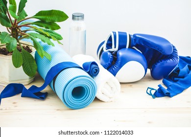 Set For Sports, A Yoga Mat, A Towel, Boxing Gloves And A Bottle Of Water On A Light Background. The Concept Of A Healthy Lifestyle