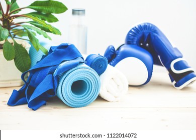 Set For Sports, A Yoga Mat, A Towel, Boxing Gloves And A Bottle Of Water On A Light Background. The Concept Of A Healthy Lifestyle.