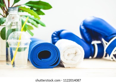 Set For Sports, A Yoga Mat, A Towel, Boxing Gloves And A Bottle Of Water On A Light Background. The Concept Of A Healthy Lifestyle