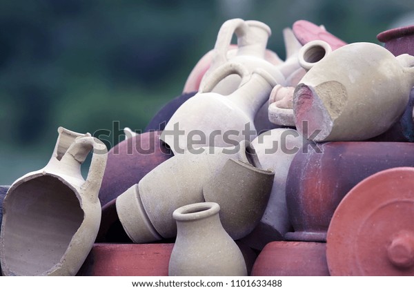 Set of stacked\
together broken clay pots
