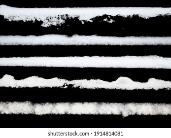 set of strips of white snow isolated on a black background. High quality photo - Shutterstock ID 1914814081