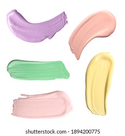 Set With Strokes Of Color Correcting Concealers On White Background, Top View