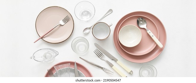 Set of stylish dinnerware and cutlery on white background, top view - Shutterstock ID 2190504547