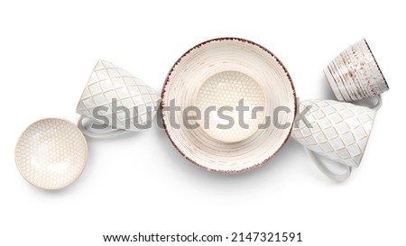 Set of stylish dinnerware on white background