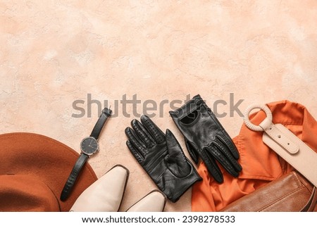 Set of stylish female accessories, shoes and clothes on color background