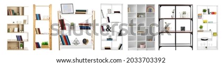 Set of stylish shelf units with decor on white background