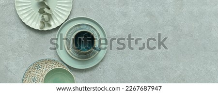 Set of stylish tableware on grunge background with space for text