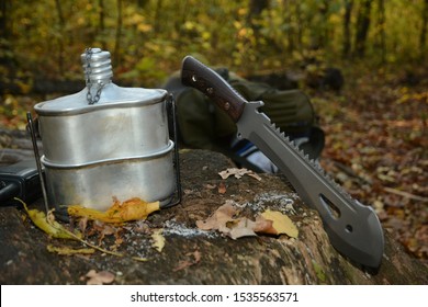 Set For Survival In The Forest. Machete, Flask,