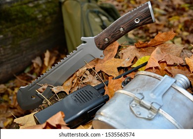 Set For Survival In The Forest. Machete, Flask,