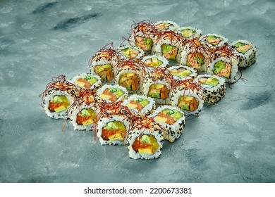 Set Of Sushi Rolls With Different Fillings On A Gray Background. Selective Focus. Noise Graine Add On Post