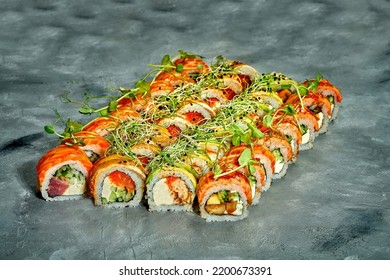 Set Of Sushi Rolls With Different Fillings On A Gray Background. Selective Focus. Noise Graine Add On Post