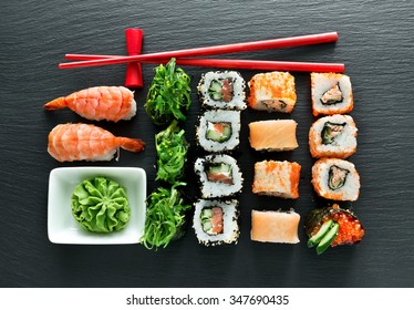 Set Of Sushi With Wasabi And Chopsticks On Slate