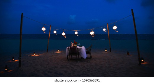 Set the table for dinner on the beach in Mui Ne Town, Phan Thiet, Vietnam. - Shutterstock ID 1590568591