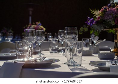 set table with empty dishes and clean glasses