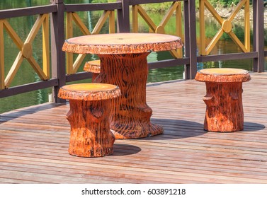 The set of table in log shape putting on the outdoor balcony .