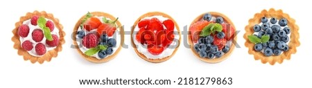 Set of tasty sweet tartlets with fresh berries on white background, top view. Banner design