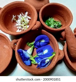 Set Of Terracotta Miniature Cooking Set With Flowers And Leaves. Ancient Cookware Using Pottery Technique. Indonesian Javanese Traditional Toys To Educate History Of Human Culture.