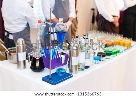 set of test tubes and various chemical devices for preparations of molecular cocktails. Multi-colored alcoholic molecular beverages for a party.