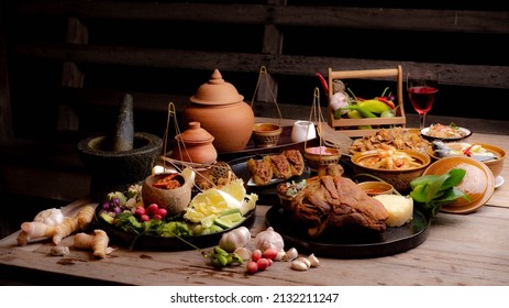 set of thai food on top table.Popular Thai food in top view isolated on wooden table background.Top view. Thai cuisine set.Collection of food dishes for the decoration of restaurants.Thai food. - Shutterstock ID 2132211247