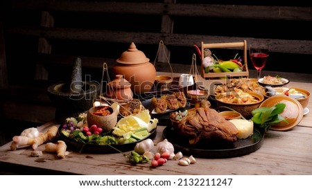 set of thai food on top table.Popular Thai food in top view isolated on wooden table background.Top view. Thai cuisine set.Collection of food dishes for the decoration of restaurants.Thai food.