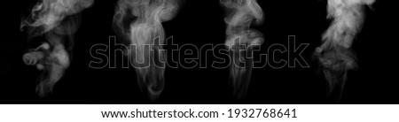 Set of thin streams of steam isolated on black background